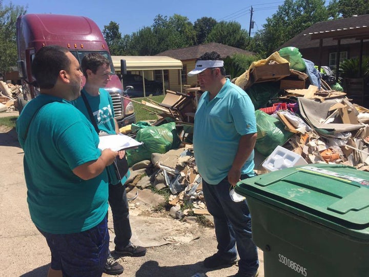 <em>Texas Organizing Project organizers visiting residents door-to-door to assess their needs and distribute critical resourc