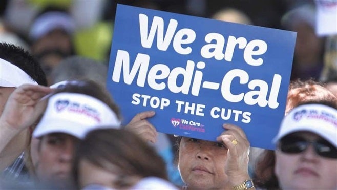 Health care workers in California protest 2013 cuts to the state’s Medicaid program that decreased payments to providers. The state is now being sued by a Latino civil rights organization that says the state’s low payment rates to doctors lead to poor care for the largely Hispanic beneficiaries that use Medicaid.