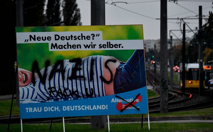 <strong>'New Germans? Let's make them ourselves,' says an AfD poster, vandalised with the word 'Nazis'</strong>