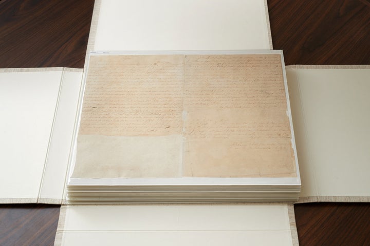 These are the first couple of pages of the printer's manuscript of the Book of Mormon. It is enclosed by folding the casing and then by sliding it into an additional case.