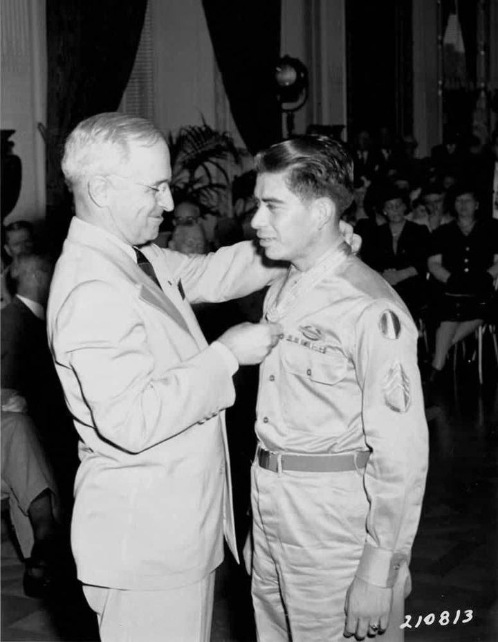 Sgt. Macario Garcia receives the Congressional Medal of Honor from President Harry S. Truman. 