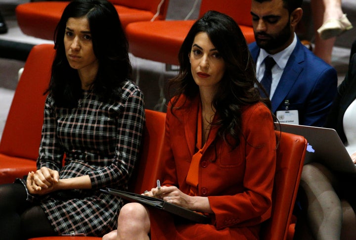 Nadia Murad, an ISIS survivor, and Amal Clooney attend a Security Council meeting set to adopt a resolution to help preserve evidence of ISIS crimes in Iraq. U.N. headquarters, New York, Sept 21.