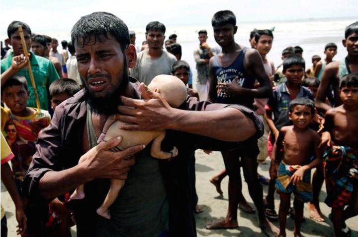 Abdul Hamid is crying while holding the lifeless body of his 40-day-old son, Abdul Masood. The infant’s only crime was that he was a son of a Rohingya. Tears fell from my eyes as I watched Abdul Hamid grieve while holding Masood to his chest. His story brought about images of the Holocaust: a sobbing father holding the lifeless body of his child. When I saw this on TV at Columbia University, tears trickled from my disbelieving eyes as I cried out loud, “Aung San Suu Kyi, you are not a Nobel laureate. You are monster. You are a disgusting blood sucker of Rohingya people. You are a female Hitler.”