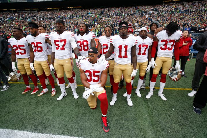 Eric Reid #35 of the San Francisco 49ers kneels during the anthem with the support of teammates prior to the game against the Seattle Seahawks at CenturyLink Field on September 17.