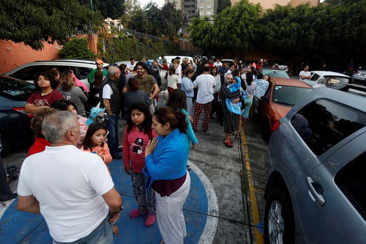 People gather inside a residential area after a tremor was felt in Mexico City, Mexico, on Sept. 23.