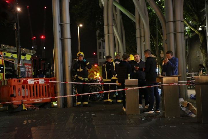 Emergency services at a cordoned-off area at the scene.