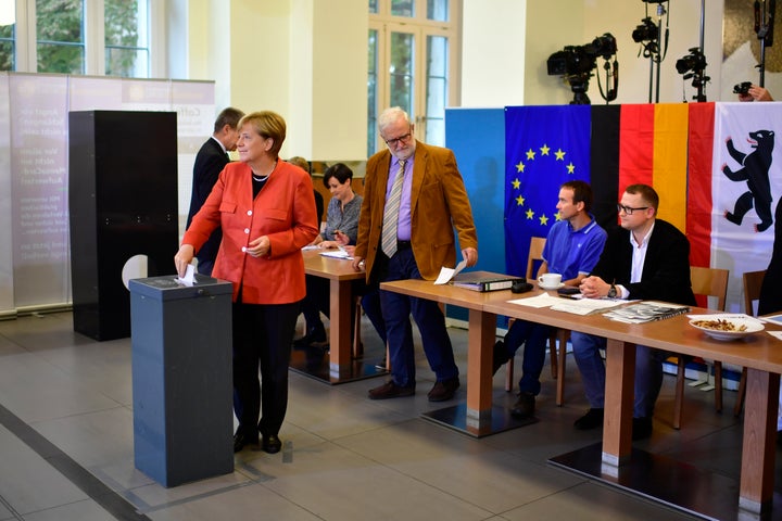 German Chancellor and Christian Democrat (CDU) Angela Merkel casts her ballot in German federal elections on September 24.