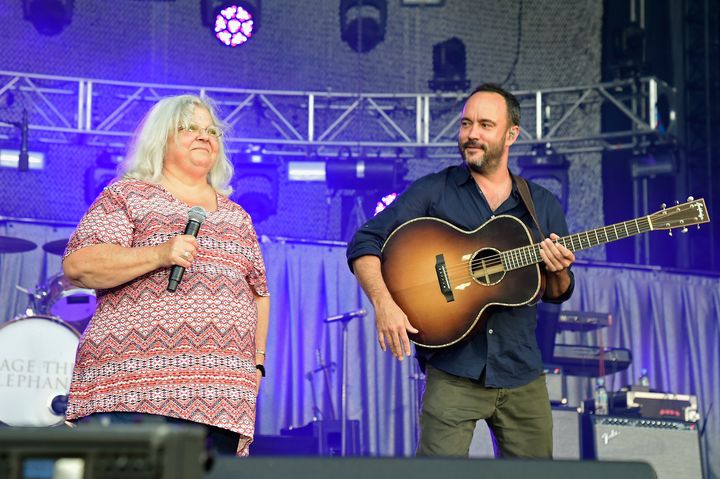 Susan Bro, mother of Heather Heyer, and Dave Matthews speak onstage at A Concert for Charlottesville.