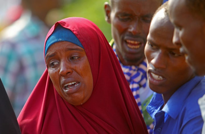 People mourn the death of family members following action by security forces 