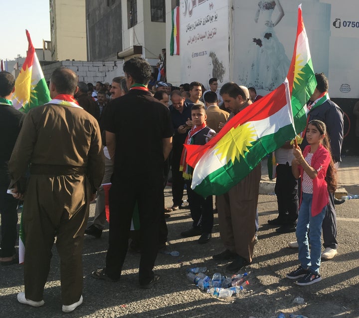 <p><em> Kurds look on at rally for independence, Erbil, Iraq, Sept. 22, 2017.</em></p>