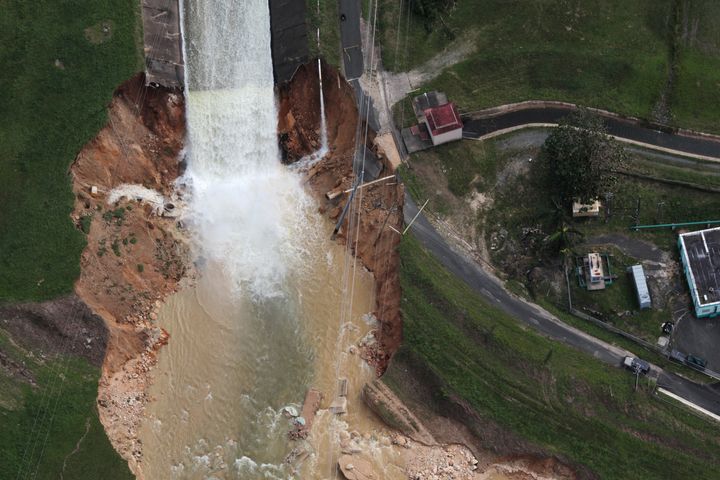 An aerial view shows the damage Saturday to the Guajataca dam in the aftermath of Hurricane Maria, in Quebradillas, Puerto Rico.