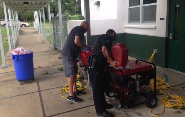 School Resource Officer Freddy Perez keeps the generators running at Westwood Middle School in Alachua County