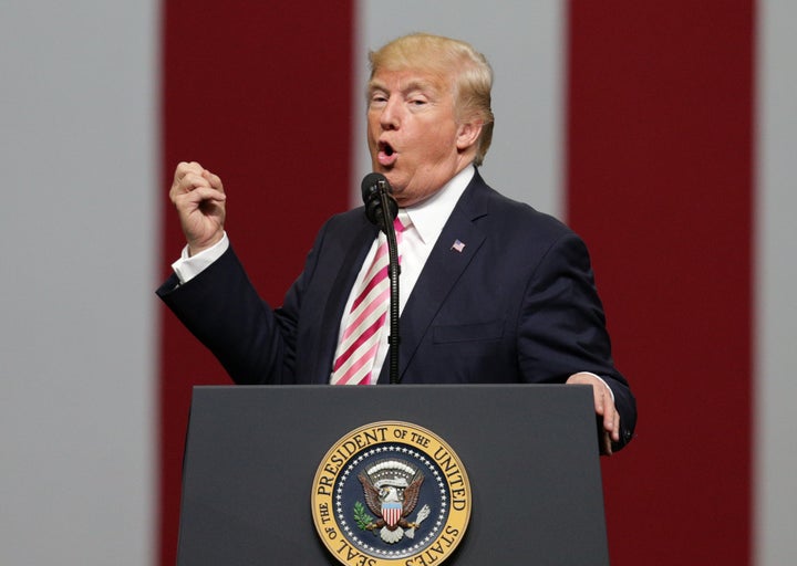 President Donald Trump speaks to supporters during a rally for Sen. Luther Strange at the Von Braun Centre in Huntsville, Alabama, on Friday.