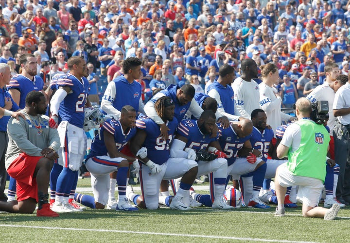 Buffalo Bills players kneel in protest during the national anthem before a game in New York against the Denver Broncos on Sun