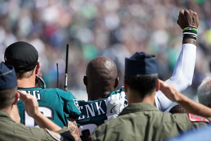 Philadelphia Eagles strong safety Malcolm Jenkins (27) and defensive end Chris Long (56) stand for the anthem prior to a game against the New York Giants on Sunday.