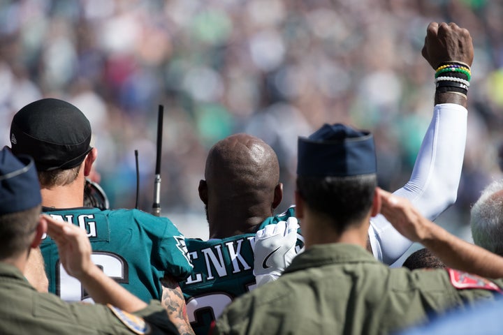 Philadelphia Eagles strong safety Malcolm Jenkins (27) and defensive end Chris Long (56) stand for the anthem prior to a game