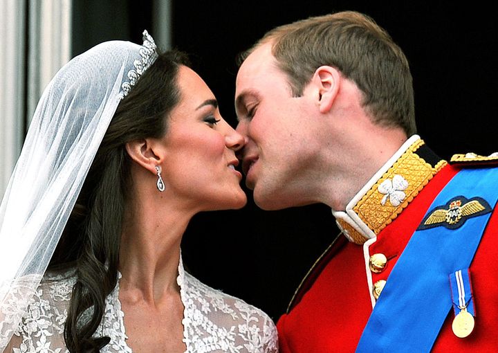 Prince William and his wife Kate Middleton, who has been given the title of The Duchess of Cambridge, kiss on the balcony of Buckingham Palace