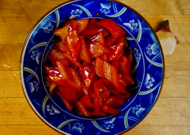 For this eggplant dish, the first thing to be cooked is ripe red peppers