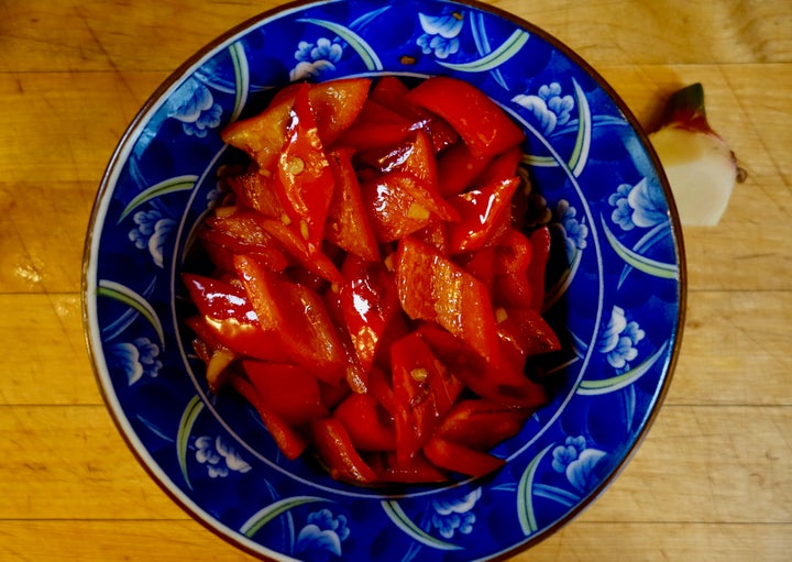 For this eggplant dish, the first thing to be cooked is ripe red peppers