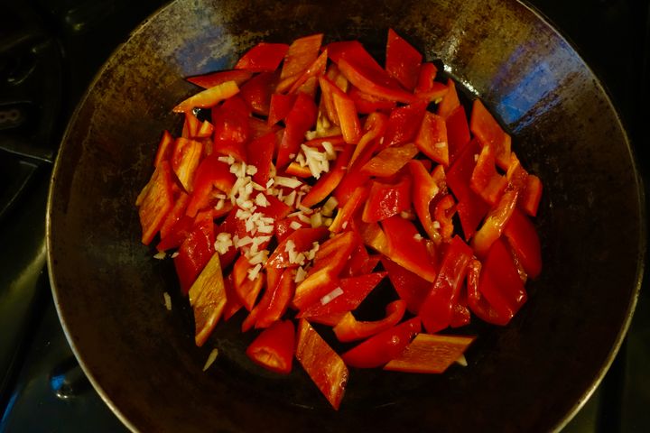 Briefly sauté the peppers with chopped ginger