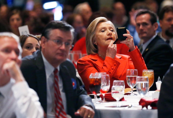 Clinton touching up her makeup before speaking at the Iowa Democratic Pary's Hall of Fame Dinner in 2015.