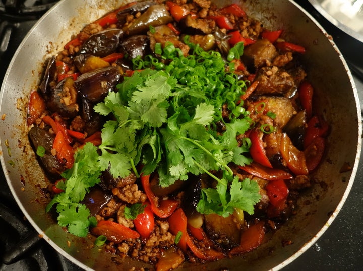 Off the heat, finish with scallion greens and cilantro