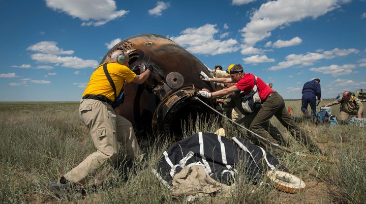 Russian support personnel roll the Soyuz TMA-19M spacecraft after it landed with Expedition 47 crew members Tim Kopra, Tim Peake, and Yuri Malenchenko.
