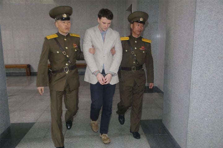 American student Otto Frederick Warmbier arrives at a court for his trial in Pyongyang, capital of the Democratic People's Republic of Korea, on March 16, 2016.