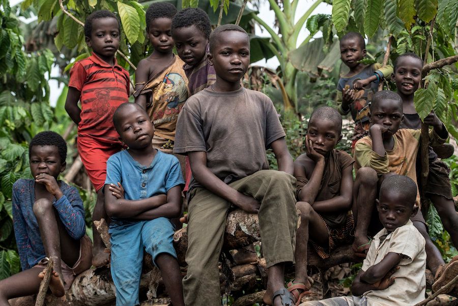 Children pose for a photo outside a rural village in Congo. Monkeypox was traced back to this country in 1970.