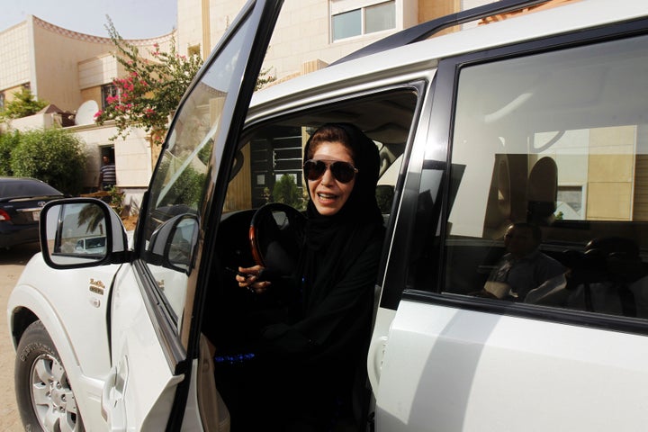 Female driver Azza Al Shmasani alights from her car after driving in defiance of the ban in Riyadh in 2011. 