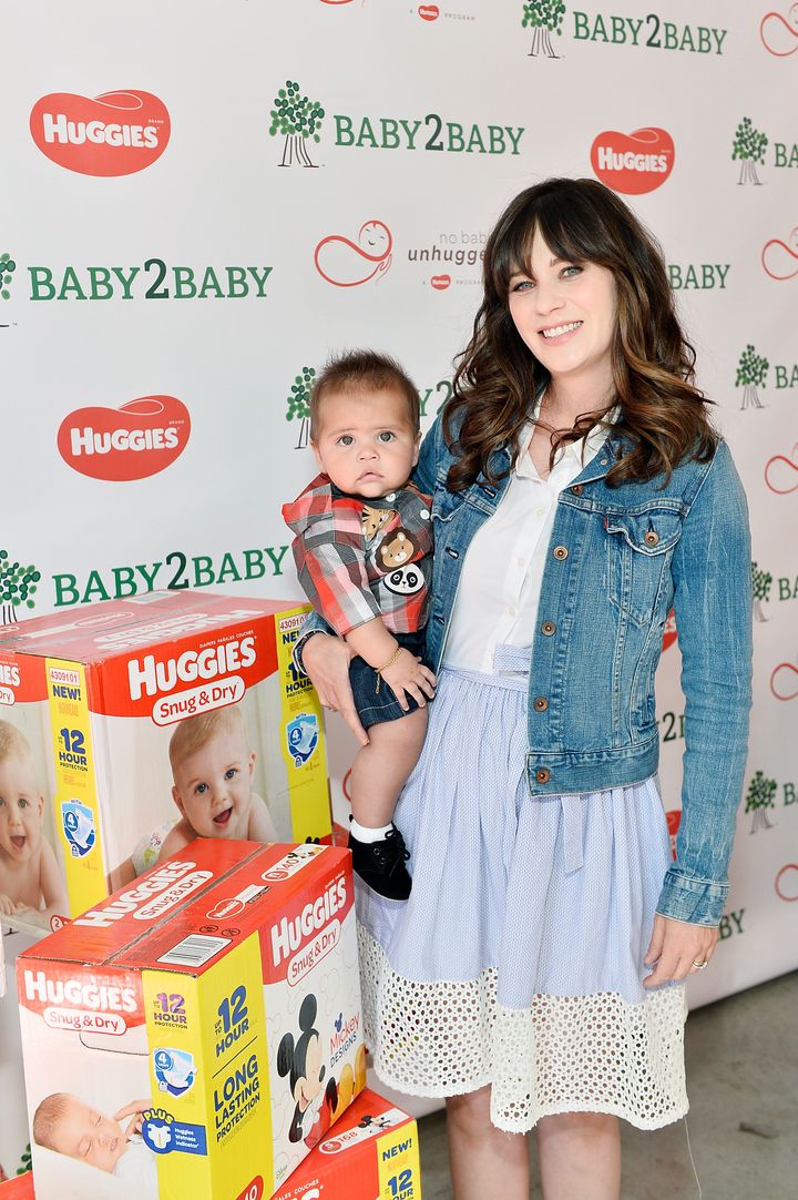 "You shouldn’t have to choose between diapers and food or diapers and clothes. It should be something that’s a given," Deschanel told HuffPost after her event. For the photo above, she posed with a child who is part of the Baby2Baby community. 