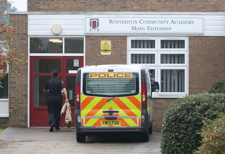 Police outside Winterton Community Academy in North Lincolnshire after a 16-year-old schoolgirl was arrested on suspicion of attempted murder following the stabbing of a welfare officer at the secondary school.