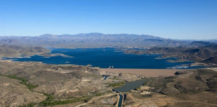 Harvesting energy from evaporation can cut the amount of water lost to natural evaporation in half, researchers say. Water-strapped cities with growing populations and energy needs could benefit most, including Phoenix, which is served by the reservoir pictured above. 