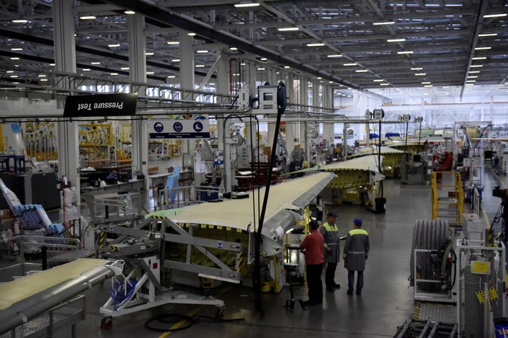 People working on C Series aeroplane wings in the Bombardier factory in Belfast, Northern Ireland.
