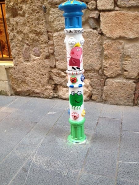<p>Wittily painted bollard in Valencia, Spain</p>