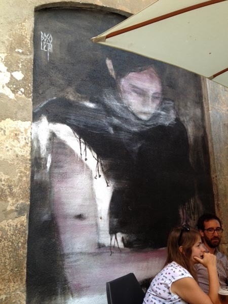 <p>Beautiful woman painted on wall of restaurant</p>