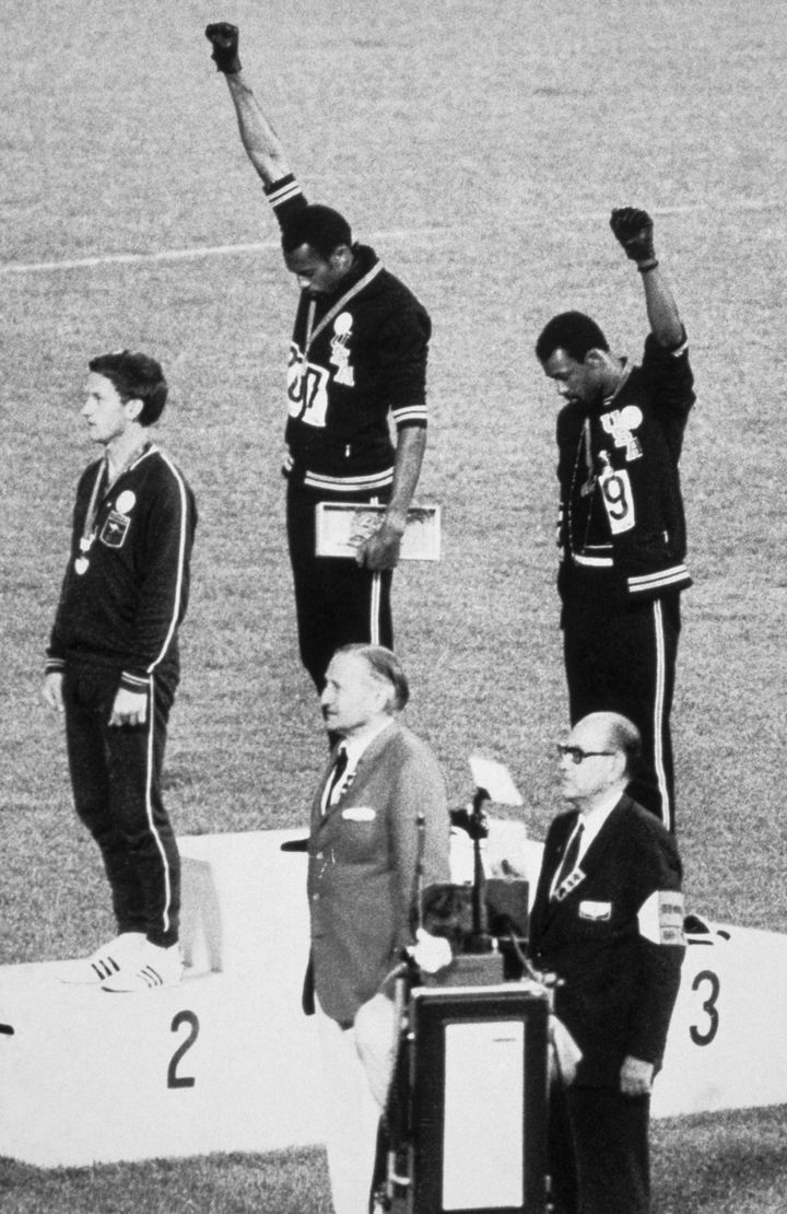 American sprinters Tommie Smith and John Carlos raise their fists on the podium at the 1968 Olympic Games in Mexico City