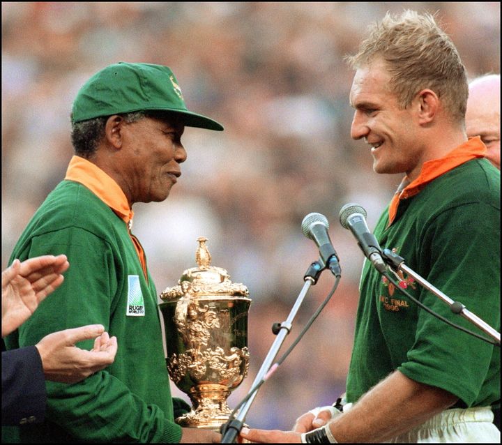 South Africa's president Nelson Mandela congratulates South Africa's rugby team captain François Pienaar after their country's World Cup win in 1995