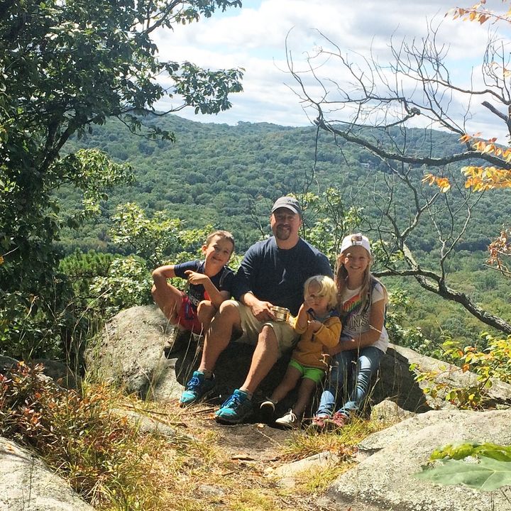 Rebekah pictured with her father and two younger brothers on a family hike.