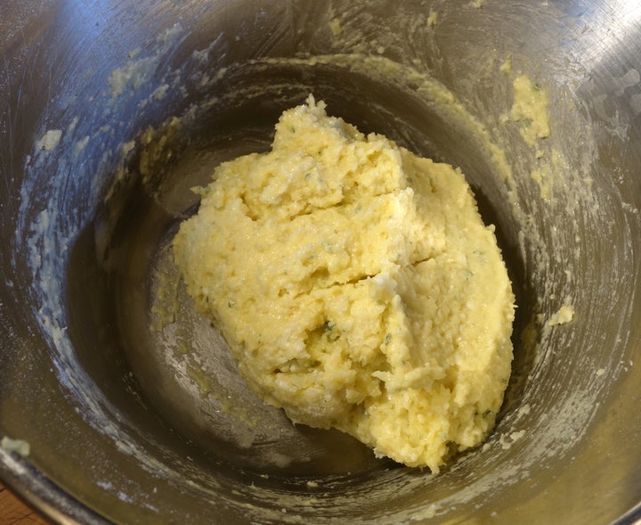 The gnocchi mixture ready to be spooned onto a wet plate before being scraped into simmering water