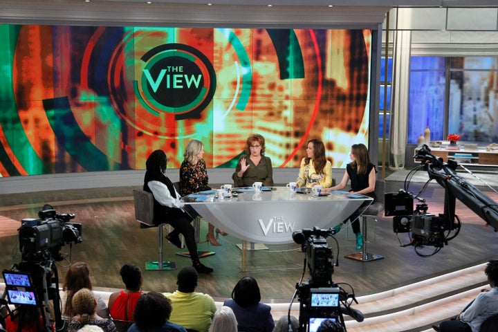 Bila sits across the table from longtime "View" co-host Whoopi Goldberg.