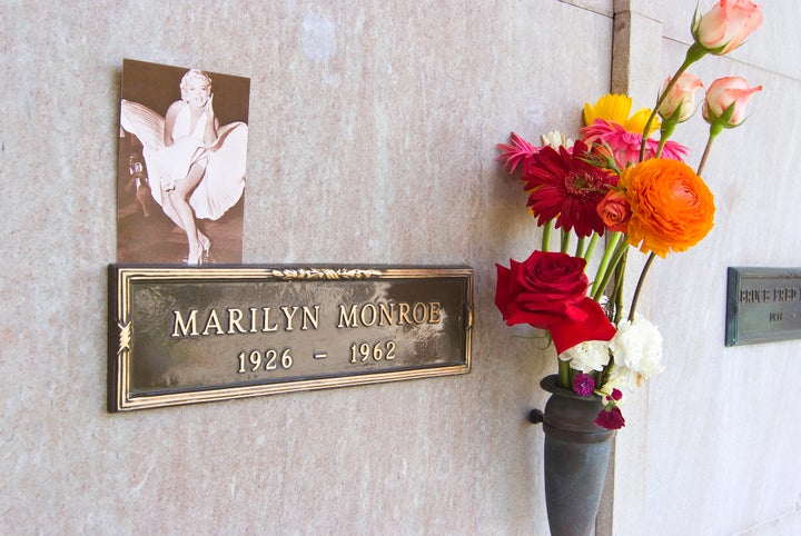 Marylin Monroe's crypt at the Westwood Memorial Park Cemetery. The crypt directly to the left of Marilyn Monroe was purchased by Hugh Hefner in 1992 for $75,000.