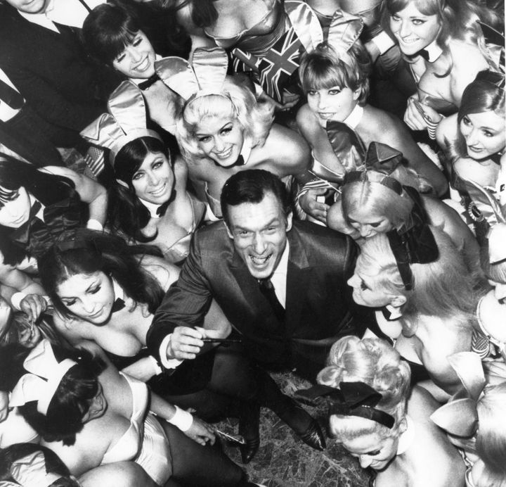 Hugh Hefner surrounded by 50 of his Playboy Bunnies on June 27, 1966, in London.