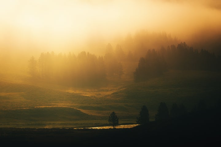 Fog fills the valley as the sun rises