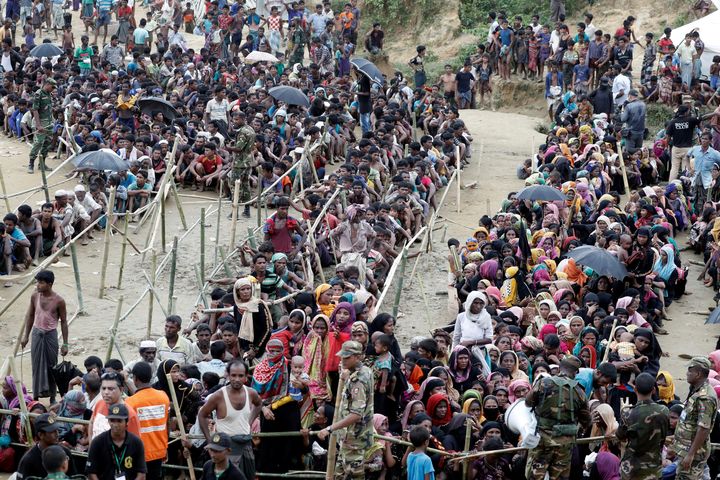 Rohingya refugees queue for aid at Cox's Bazar on Sept. 26.