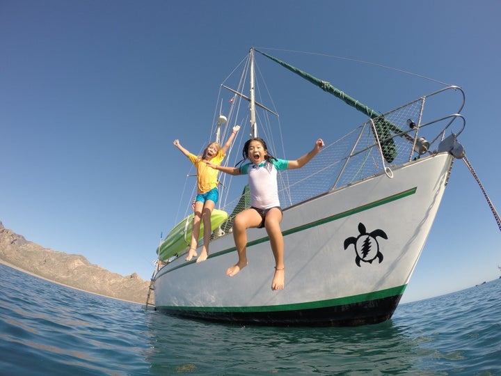 Jessica (left) loves learning about the geography and cultures of the places to which she and her family sails. Emma (right) enjoys swimming, snorkeling and being in the water every day.