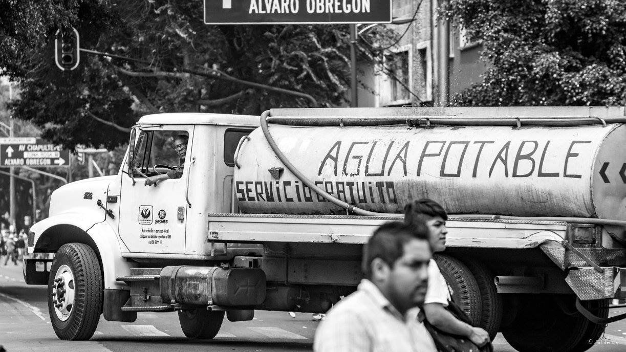 A truck carries potable water. Across Mexico City donation organizations need supplies, including water, batteries, medicine, food and canned goods.