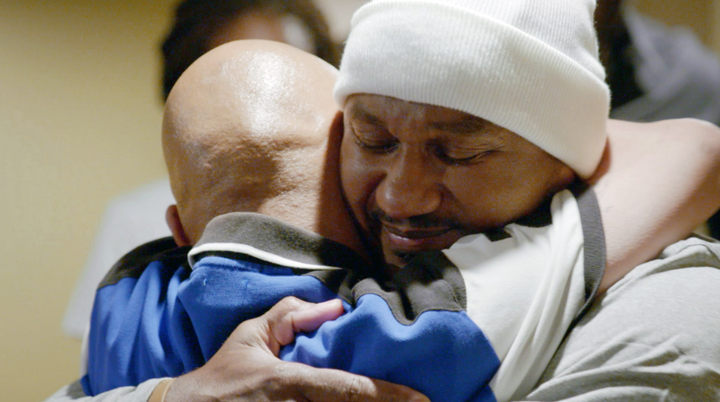 Kevin hugs and greets family members and friends after his release from prison. 