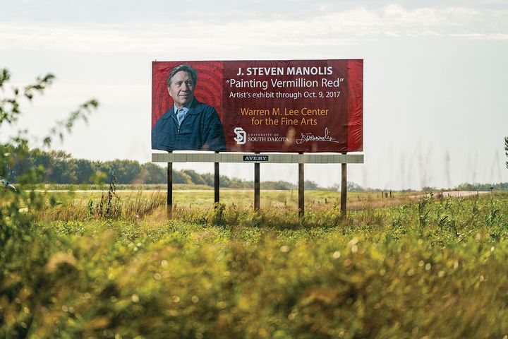 Billboard commemorating J. Steven Manolis’ “Painting Vermillion Red” exhibition. Highway 50, South Dakota.