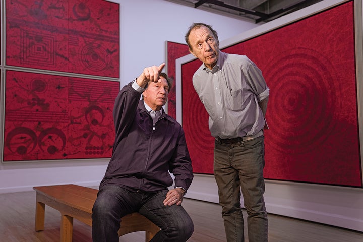 <p>J. Steven Manolis and art critic Anthony Haden-Guest reviewing elements of the “Painting Vermillion Red” exhibit at the John A. Day Gallery at the Warren M. Lee Center for the Fine Arts, University of South Dakota. </p>